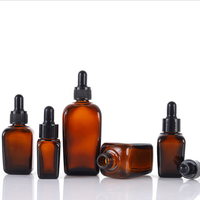 Vente en gros de flacons compte-gouttes carrés en verre ambré de 30ml Récipient d'huile essentielle de luxe avec une commande minimum de 100 pièces emballé dans des cartons