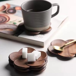 Creative black walnut wood coasters with petal designs, solid wood <b>teacup</b> holders, coffee cup holders, and heat-insulating - Product Image 1