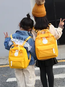 Mini bolso de viaje pequeño con logotipo personalizado para niños y niñas, mochila de diseñador para exteriores