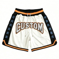 Shorts de basket rétro pour hommes, lettres brodées personnalisées, respirants, séchage rapide, imprimés numériquement, orange et noir, en mesh.