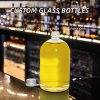 Bouteille en verre plate ronde transparente vide avec bouchon à vis en aluminium pour l'emballage de spiritueux, d'huiles essentielles et de cosmétiques – Vente en gros usine