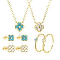 Collier, bague et boucles d'oreilles en argent sterling 925 avec pendentif trèfle à quatre feuilles de luxe SPJ Wholesale pour femmes et filles.