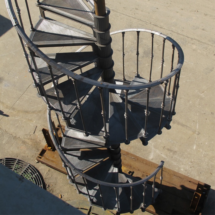 Cast iron outdoor spiral staircase with baluster and handrail