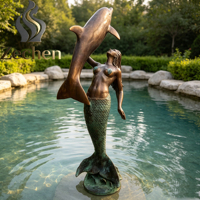 Statues de sirène et de dauphin en bronze coulé sur mesure, utilisées pour la mise en scène aquatique de la villa de plage en bord de mer