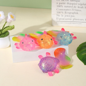 Giocattolo Squishy Antistress a Forma di Pesce Rosso con Polvere Dorata e Coda Colorata, un Giocattolo Originale e Unico - Product Image 1