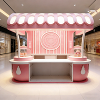 Airy Luxe Bakery & Coffee Market Stall Featuring Glass Display Case, Open Tiered Shelving, and Integrated Warm Lighting