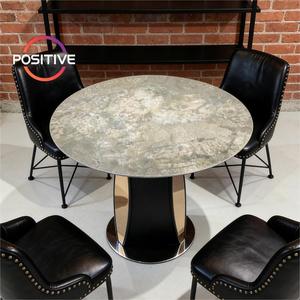 Mesa de Comedor con Tapa de Mármol Artificial, Base de Madera Maciza y Acero Inoxidable, Forma Redonda para Uso en Hogares Modernos - Product Image 1