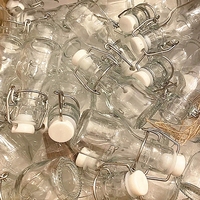 Bouteilles de stockage Mini Swing Top Verre 2 Oz 30ml 60ml 150ml Bouteilles de bière vides Boissons Extrémité ouverte facile Logo de couleur personnalisé Acceptable