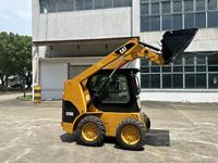Mini-chargeuse sur pneus Caterpillar Japon, fonctionnement fiable, excavation efficace, travaux de construction lourds