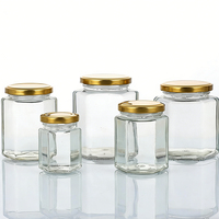 Pot en verre hexagonal transparent de qualité supérieure, résistant aux hautes températures, pour confiture, sauce chili, pâte de citron, miel, aliments, avec couvercles