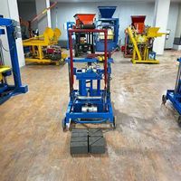 Machine industrielle électrique mobile manuelle 2-45 pour la fabrication de briques creuses en cendres volantes et de pavés, avec moteur et roulement