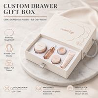 Boîte cadeau coulissante blanc crème avec poignée en corde tressée et contour nuage en feuille d'or rose pour emballage cosmétique