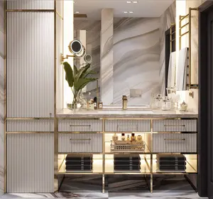 polished gold plated stainless steel framed bathroom cabinet and sink unit for luxurious hotel and executive suite