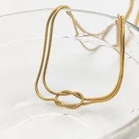 Collier pour femme EMANCO minimaliste et élégant en acier inoxydable plaqué or 14 carats avec chaîne en corde et pendentif nœud pour fiançailles