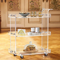 Arabie Saoudite Vente chaude Chariot de bar moderne à 3 niveaux en acrylique transparent Lucite pour salle à manger, hôtel, service de boissons, chariot à roulettes