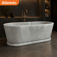 Baignoire ovale autoportante en marbre blanc veiné gris, monobloc massif avec socle, pour hôtel, villa, salle de bain