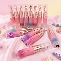Baume à lèvres végétalien hydratant et repulpant, à pigmentation intense, changeant de couleur, saveur fruitée, avec applicateur à pression, marque privée, effet gloss et beurre pour les lèvres
