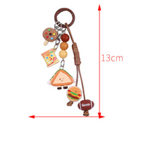 Porte-clés amusant en forme de biscuit burger de dessin animé, mignon et créatif, jouet alimentaire ludique, pendentif pour la décoration de clés et sacs, design en caoutchouc