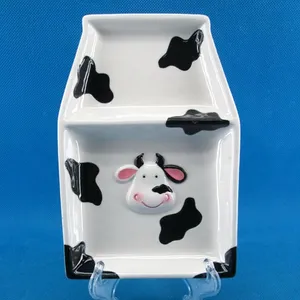 Hand-painted ceramic cookie plate with cow design