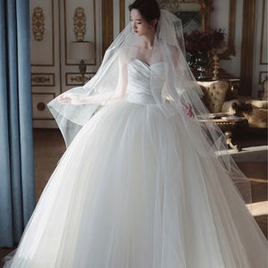 Robe de mariée <span class=keywords><strong>bustier</strong></span> personnalisée en gros, nouvelle collection, style simple Qi Di, fin, style Hepburn, coréen, nœud, <span class=keywords><strong>voile</strong></span> léger français - Product Image 1