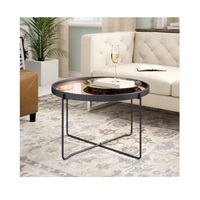 Table basse ronde moderne au design indien tendance avec plateau en verre trempé et structure en métal pour le mobilier de salon