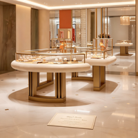 Vitrine de présentation de bijoux ronde de luxe, cadre en métal doré, dessus en verre, comptoir d'îlot pour bijoux avec plateaux de présentation, boutique personnalisée
