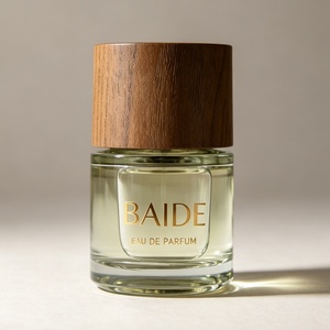 Botella de Perfume de Vidrio Cilíndrica Vacía de Lujo con Logotipo Estampado en Oro Personalizado, 30ml 50ml 100ml, Botella de Perfume Transparente con Tapa de Madera - Product Image 1