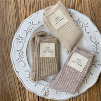Vente en gros de chaussettes en laine pour femmes, chaussettes en cachemire pour hommes, chaussettes thermiques épaisses en fibre pour l'hiver