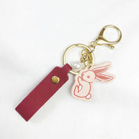 Porte-clés pendentif lapin charmant en cuir avec bracelet, style perle, fermoir doré pour sac à dos et sac à main