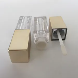 Tubo per lucidalabbra trasparente quadrato in plastica con logo personalizzato con tappo dorato, contenitore per lucidalabbra trasparente con coperchio dorato