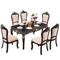 Ensemble de salle à manger néoclassique européen en gros, table rectangulaire en bois d'acajou noir avec plateau en marbre et accents dorés rotatifs