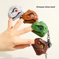 Creativo dinosaurio cabeza morder dedo tirar hacia atrás respetuoso con el medio ambiente plástico coche de juguete pequeña muñeca colgante llavero mochila para niños