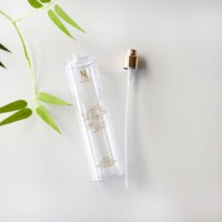 Échantillon et bouteille transparente en plastique de 250ml de forme ronde de style luxueux avec pulvérisateur doré pour cosmétiques