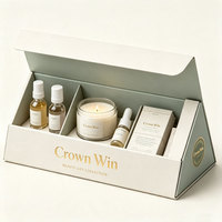 Boîte cadeau pliable avec fermeture magnétique, emballage rigide en carton pour cosmétiques, avec insert en mousse pour sérum, parfum et autres produits de soin.