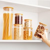 Frascos de almacenamiento de vidrio transparente de borosilicato hermético de Venta caliente con tapas de bambú para contenedor de embalaje de almacenamiento de alimentos