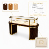 Gebogene Schmuck-Vitrine Glas-Schaukasten Theke LED-Beleuchtung Modernes Holz Gold für Boutique Einkaufszentrum Ausstellungsraum Ladeneinrichtung