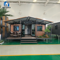 Maison conteneur modulaire préfabriquée de luxe 20 pieds, entièrement meublée, avec salle de bain et chambre intégrées, design moderne, personnalisable, pour famille à long terme
