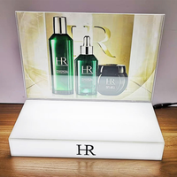 Support de présentation de comptoir personnalisé en acrylique moderne avec base miroir argentée pour cosmétiques, maquillage et soins de la peau, amovible et réutilisable