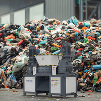 Broyeur polyvalent à double arbre de petite taille pour la réduction de la taille des palettes en plastique, des fûts, des barils et autres articles en vrac