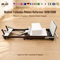 Reformer Pilates en bois de noyer couleur personnalisée, pliable, équipement de yoga professionnel, machine de renforcement musculaire haut de gamme, approvisionnement direct usine MJD