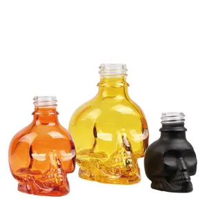 Fabricante de color personalizado 15ml 30ml botella de aceite esencial de vidrio con forma de calavera
