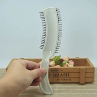 Brosse à cheveux frisottis en forme de S avec peigne de contour de salon à poils en nylon pour les femmes