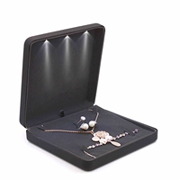 Boîtes de rangement pour bijoux en velours avec logo personnalisé OEM, bracelet lumineux noir, boucles d'oreilles, ensemble d'affichage LED, boîte cadeau pour bijoux