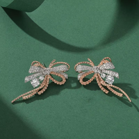 Ensemble de bijoux de fête et de mariage avec boucles d'oreilles, collier et bague en zircon Palaiba, orné d'un nœud et de pompons, style mode, fourni par l'usine
