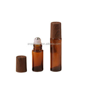 Mini flacon à bille en verre ambré transparent portable de 5 ml et 10 ml pour parfum et huile essentielle, en stock, MOQ de 100 pièces, comprenant le capuchon d'emballage - Product Image 1