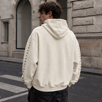 Sweat à capuche unisexe OEM surdimensionné en molleton épais, délavé à l'acide, avec imprimé lettres stencil et manches cloutées, style streetwear
