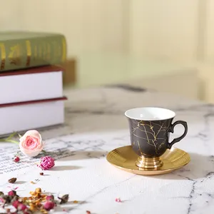 Amber gold-plated matt black porcelain ware coffee and tea cup with aluminum saucer and aluminum bottle