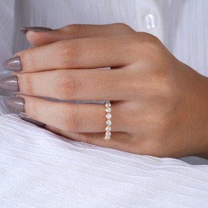 Luxury diamond eternity <b>ring</b> worn on woman hand showcasing elegant jewelry style ideal <b>wedding</b> engagement and everyday fashion - Product Image 5