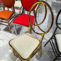 Chaise Chiavari en fer en gros, chaise de château à dossier rond avec coussin en cuir blanc pour hôtel, mariage, événement