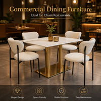 Ensemble de salle à manger élégant, chaise en bouclette et table en pierre avec base dorée pour restaurant, café, salon et hôtel.
